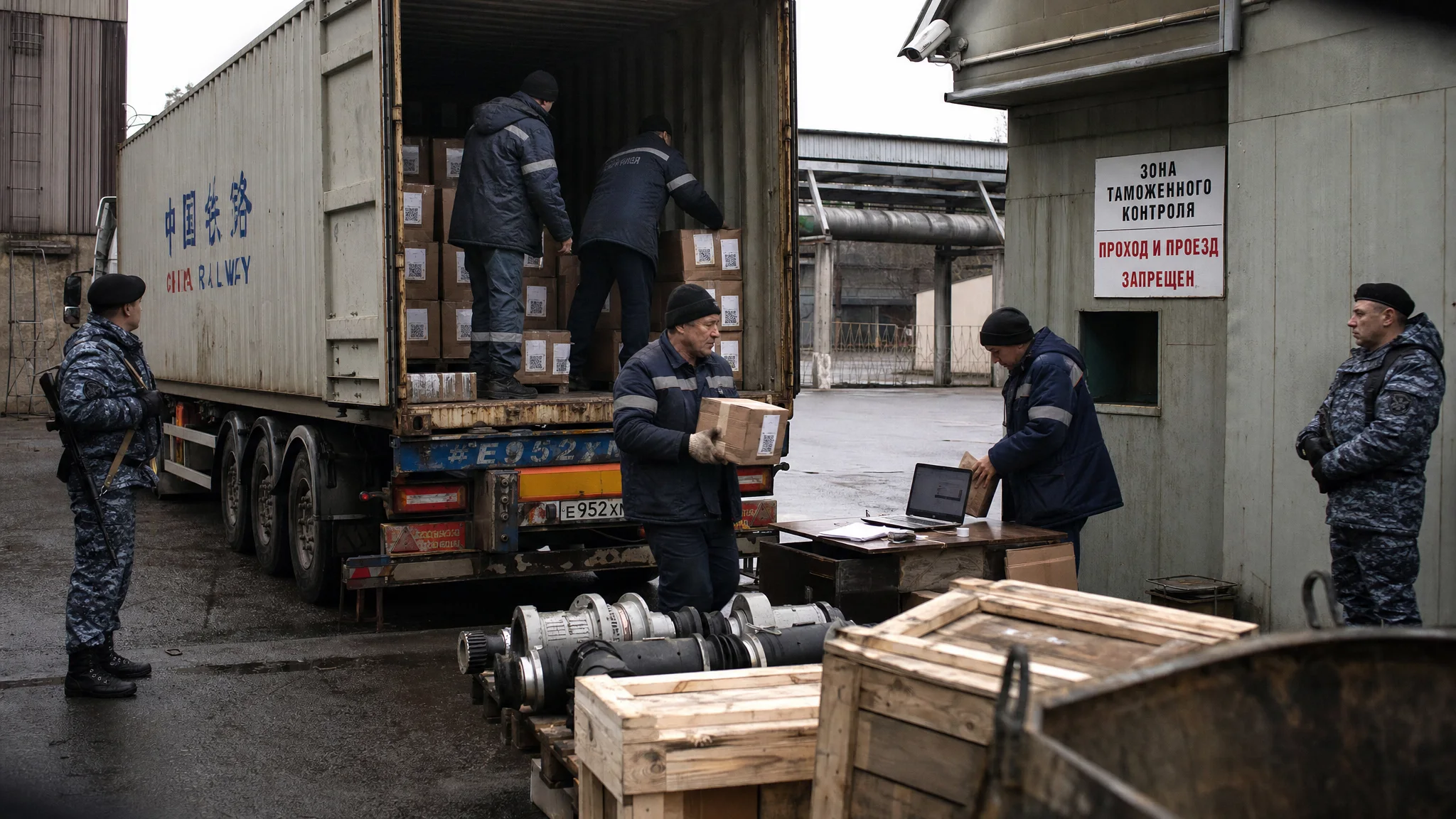 Engineers in a secure Russian warehouse unload components from a Chinese truck under surveillance. Engineers in a secure Russian warehouse unload components from a Chinese truck under surveillance.